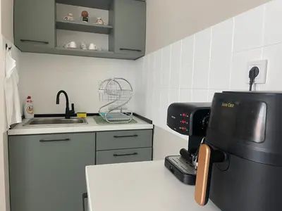 a kitchen with a sink and a coffee maker at KudevApartment1 in Nesebar