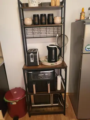 a shelf with a microwave and a coffee maker on it at Vineyard luxery spa resort in Kableshkovo