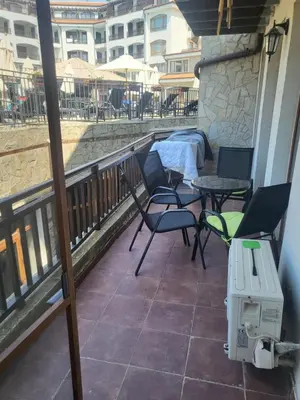 a balcony with chairs and tables on a building at Vineyard luxery spa resort in Kableshkovo