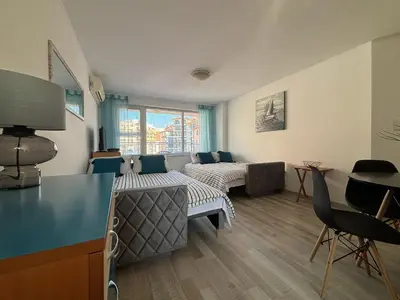 a living room with a couch and a table at BW - Aquamarin C6 in Sunny Beach