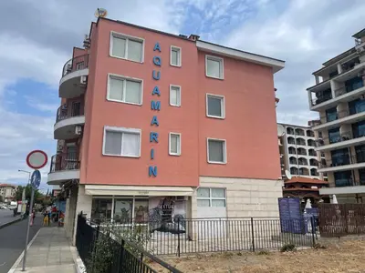 a building with a sign on the side of it at BW - Aquamarin C6 in Sunny Beach