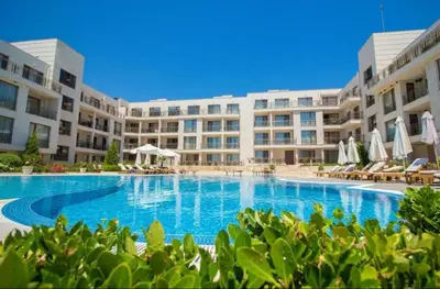 a large swimming pool in front of a building at June Sea view Studio Apartment in Burgas City