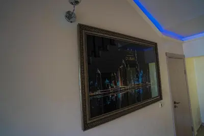 a picture hanging on a wall in a room at AR Luxury VIP Apartments Ravda in Ravda