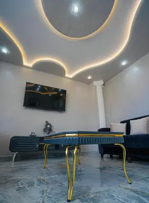 a living room with a couch and a table at AR Luxury VIP Apartments Ravda in Ravda