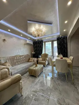 a living room with a couch and a table at AR Luxury VIP Apartments Ravda in Ravda