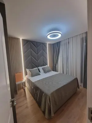 a bedroom with a large bed in a room at Harmony Suites 16 in Sunny Beach