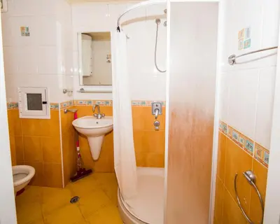 a bathroom with a shower and a sink and a toilet at LAZUR - Nice Sunny Flat in Burgas City