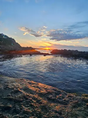 a view of a river with the sunset in the background at Dimargo in Lozenets