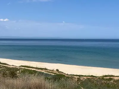 an empty beach with the ocean in the background at Aquamarine Studio in Santa Marina in Sozopol