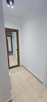 a room with a mirror and a tile floor at Studio Nikol in Burgas City