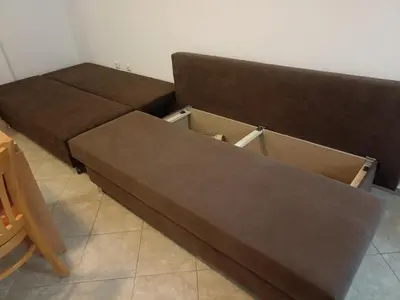 two brown beds in a room with a table at SilverSprings Lucie in Sunny Beach