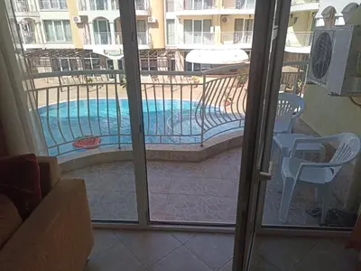 a view of a swimming pool through a sliding glass door at SilverSprings Lucie in Sunny Beach