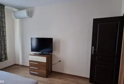 a bedroom with a flat screen tv on a dresser at De Ja Vu- Zdravez in Burgas City