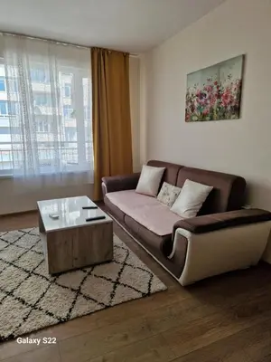 a living room with a couch and a coffee table at De Ja Vu- Zdravez in Burgas City