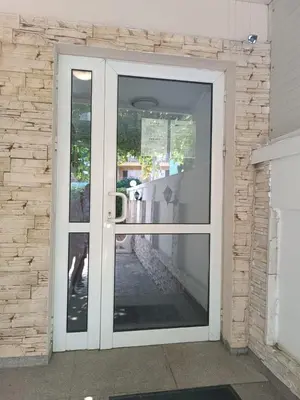 an open door with a view of a patio at Sunny Beach Apartment, Kokiche Hotel - white building Liliya in Sunny Beach