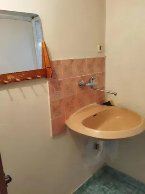 a bathroom with a sink and a mirror at Къща за гости дом Попови Черноморец in Chernomorets