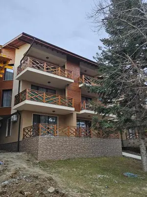 a large building with a balcony on the side of it at Denevi' seaside apartment - 2 bedrooms in Lozenets