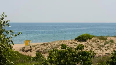 a sandy beach with the ocean in the background at Denevi' seaside apartment - 2 bedrooms in Lozenets