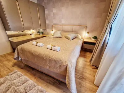 a bedroom with two beds with towels on them at Delux Apart Vulchevi with Parking in Burgas City