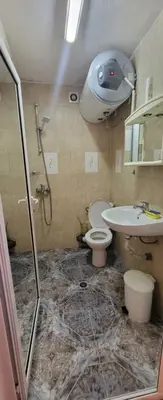 a bathroom with a shower and a toilet and a sink at Unique Apartment with Balcony in Pomorie Old Town by Flat Mаnаger in Pomorie