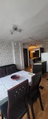 a kitchen with a table and chairs and a dining room at Unique Apartment with Balcony in Pomorie Old Town by Flat Mаnаger in Pomorie