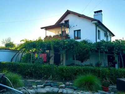 a house with a bunch of vines on it at Вила 50 in Atiya