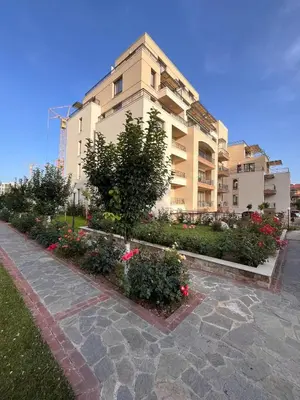 a building with flowers and plants in front of it at Sorrento Sole Mare Studio Appartment in Sveti Vlas