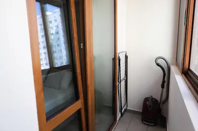 a glass door in a room with a window at Azur Holiday Burgas - self check-in in Burgas City