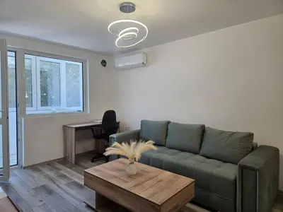 a living room with a couch and a table at Ann's apartment in Varna City