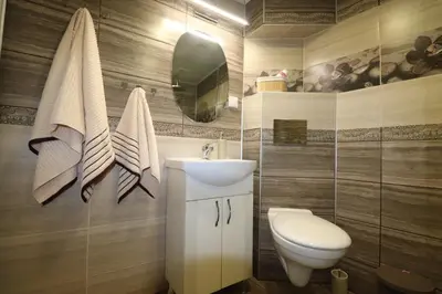 a bathroom with a sink and a toilet at Relax apartment with parking in Varna City