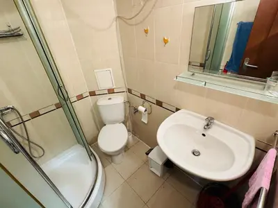 a bathroom with a sink and a toilet and a shower at AMADEUS I B31 Apartment Sunny Beach in Sunny Beach