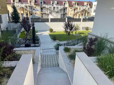 a walkway in a courtyard of a apartment building at Студио Морски дни-топ локация в Созопол in Sozopol