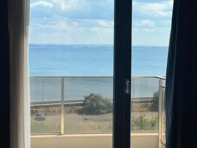 a view of the ocean from a window at Apartament Panorama in Pomorie