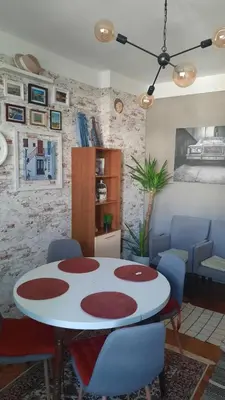 a dining room with a table and chairs at BOHO Apartment in Varna City