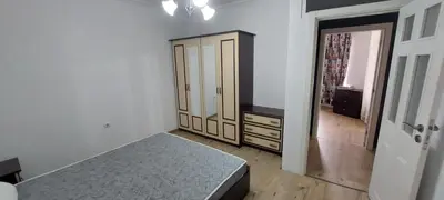 a bedroom with a bed and a dresser and a mirror at Marina bay in Sveti Vlas