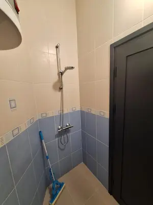 a bathroom with a shower with a toothbrush in it at Apartment Black Sea Center 1 in Varna City