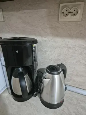 a coffee maker and a tea kettle on a counter at Делукс Апарт Вергиеви in Burgas City