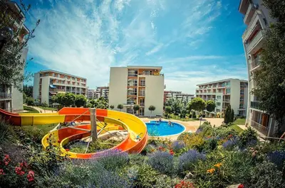 a resort with a pool and a water slide at Fort Noks Panorama in Elenite