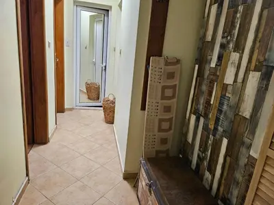 a hallway of a house with a tile floor at Стая за гости на Бургас 1 in Burgas City