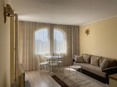 a living room with a couch and a table at Charming 1 bedroom apartment in Sunny Beach in Sunny Beach
