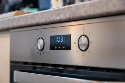 a clock on the front of a oven at Seagull Apartment in Varna City