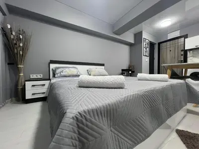 a bedroom with a large bed in a room at NJ bedroom in Varna City