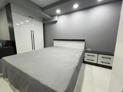a bedroom with a large bed in a room at NJ Luxury Room in Varna City
