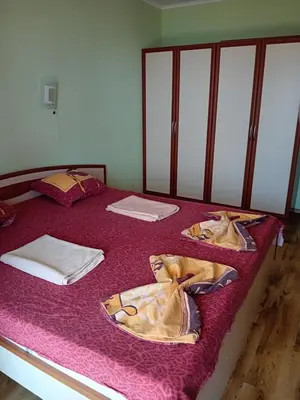 a bedroom with two beds with blankets on them at Златна Дюна - до южния плаж на Несебър in Nesebar