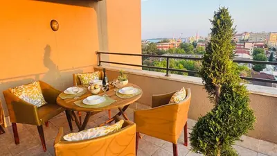 a table and chairs on a balcony with a view at Luxury sea view, 5star Barcelo on Beach in Sunny Beach