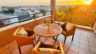 a table and chairs on a balcony with a view at Luxury sea view, 5star Barcelo on Beach in Sunny Beach