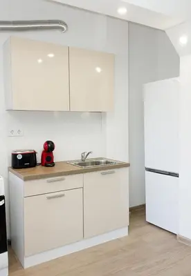 a kitchen with white cabinets and a sink at Bright 2-Bedroom Apartment Near Varna City Center by Flat Mаnаger in Varna City