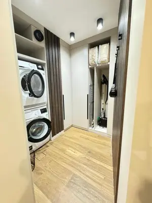 a laundry room with a washer and dryer at Kandinski Lux Apart in Burgas City