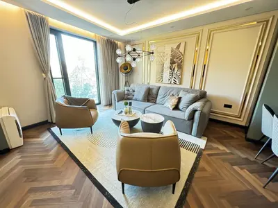 a living room with a couch and chairs at Kandinski Lux Apart in Burgas City