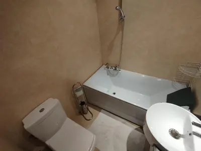 a bathroom with a toilet and a sink and a tub at Garden of Eden - Sea View studio in Sveti Vlas